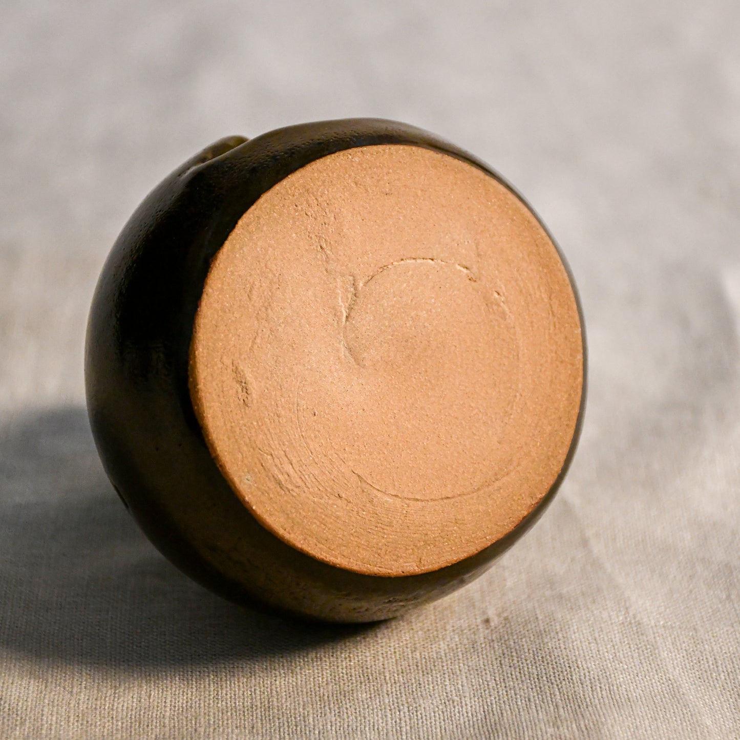 Handmade countertop chiminea, wheel thrown, hand-carved, glazed in Coffee Bean glaze.