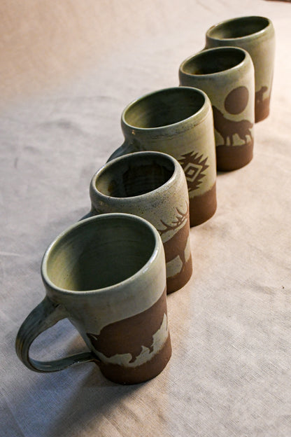 Wild Rojo 5-mug set in sage green with 5 original designs of a bison, elk, aztec, wolf, and bears.