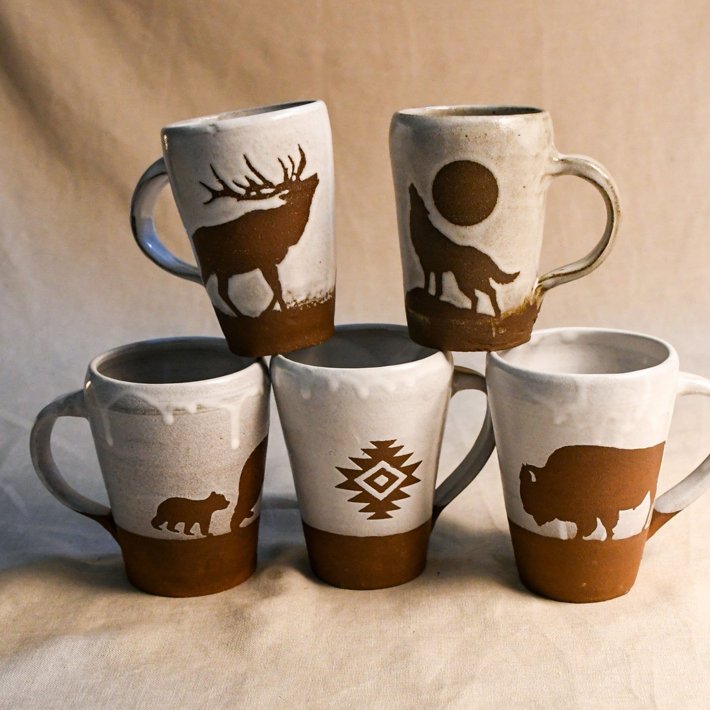 Wild Rojo 5-mug set in white with 5 original designs of a bison, elk, aztec, wolf, and bears.