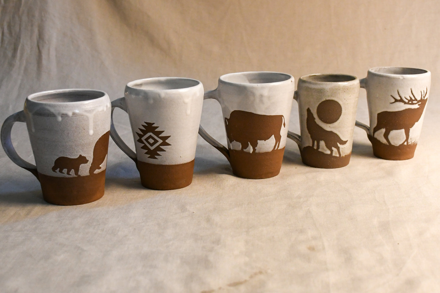 Wild Rojo 5-mug set in white with 5 original designs of a bison, elk, aztec, wolf, and bears.