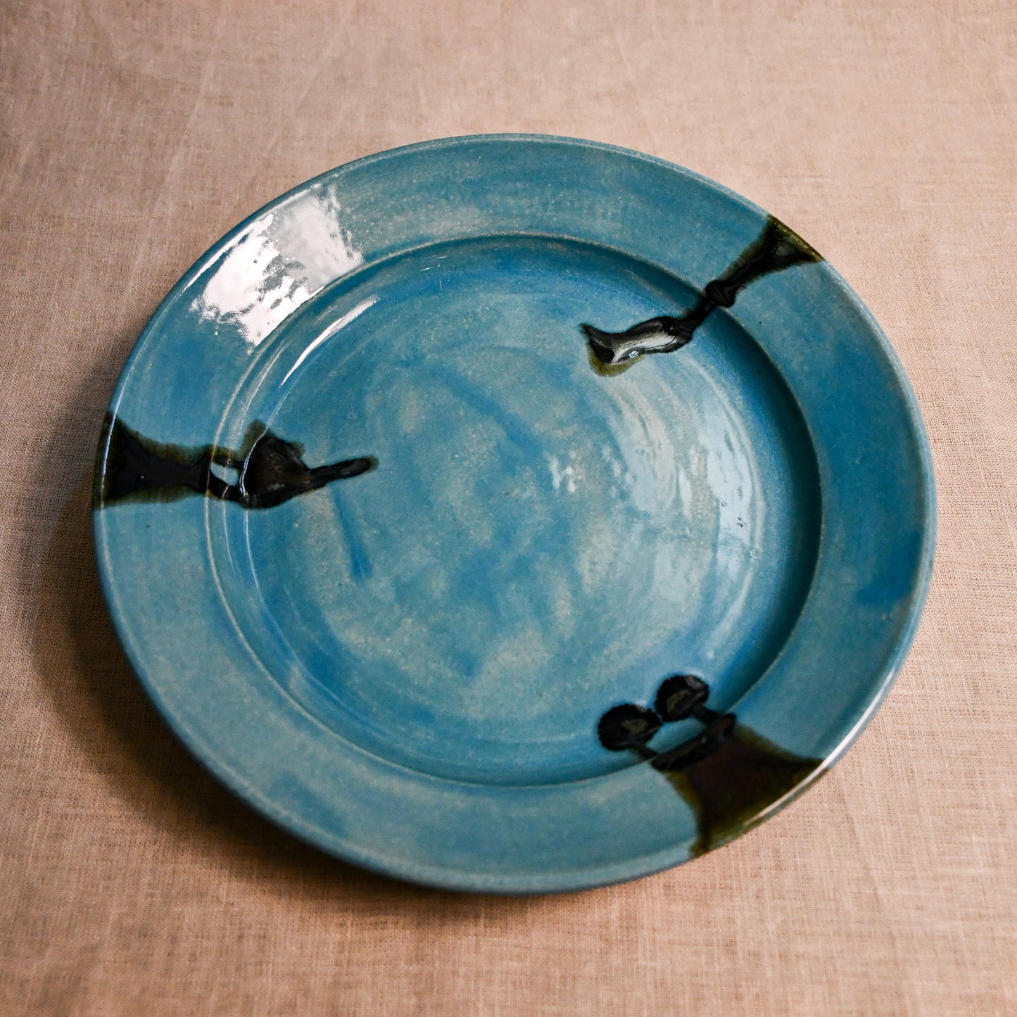 Turquoise handmade wheelthrown pottery dinner plate from the 5th Buffalo collection by Leigh Art