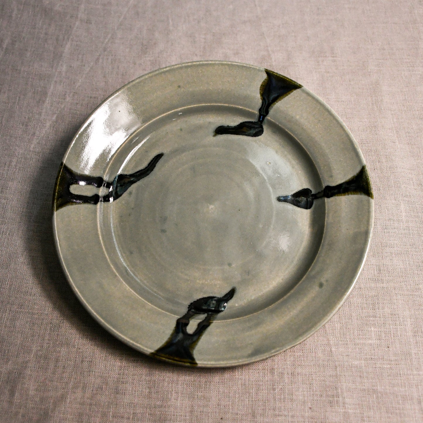 Grey handmade wheelthrown pottery dinner plate from the 5th Buffalo collection by Leigh Art