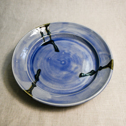 Purple handmade wheelthrown pottery dinner plate from the 5th Buffalo collection by Leigh Art