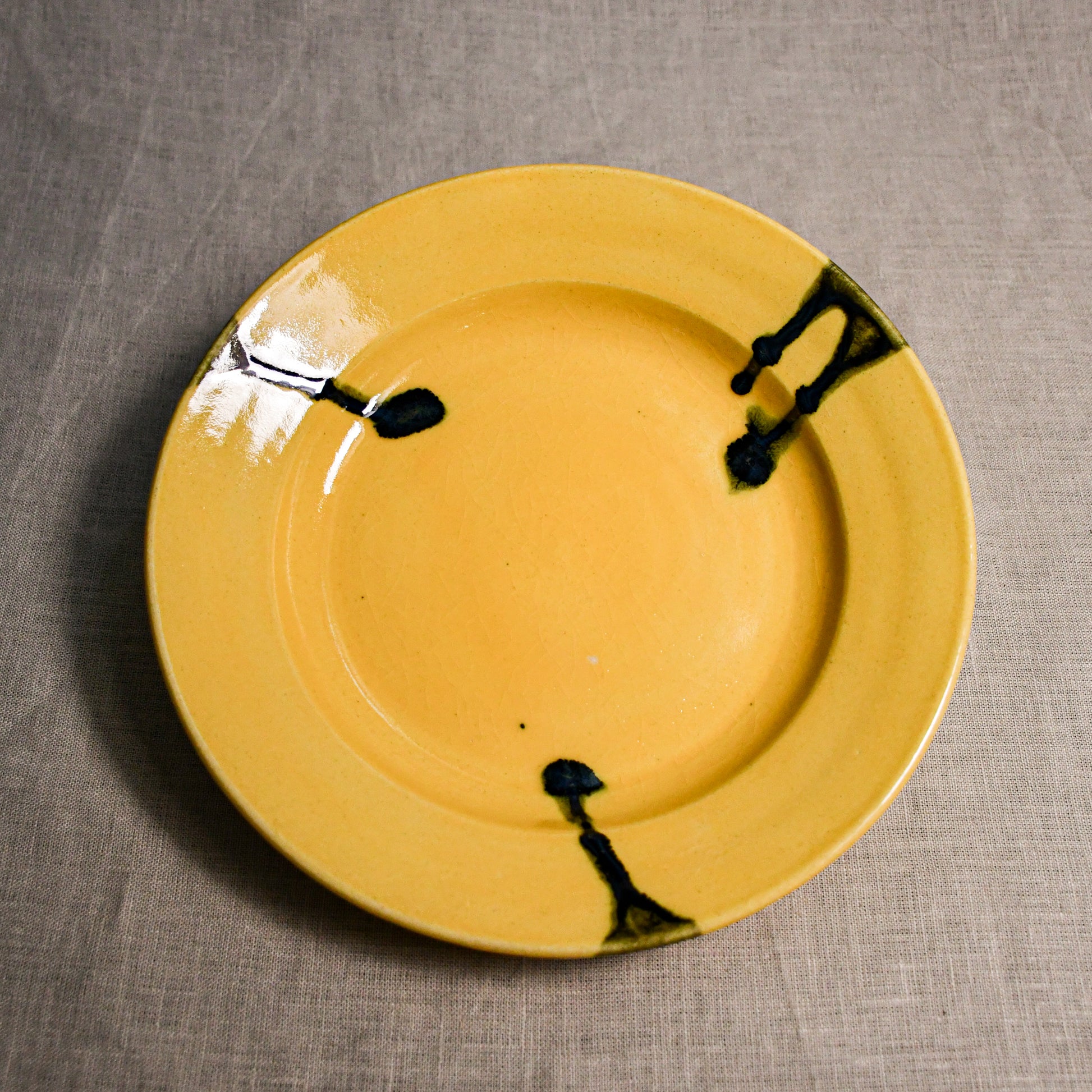 Yellow handmade wheelthrown pottery dinner plate from the 5th Buffalo collection by Leigh Art