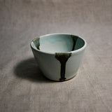 Pale blue handmade wheelthrown salsa bowl with black drips from the 5th Buffalo collection by Leigh Art.
