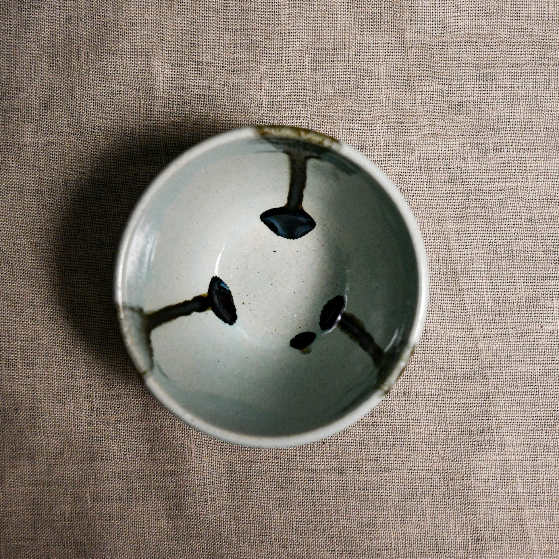 Interior image of a pale blue handmade wheelthrown salsa bowl from the 5th Buffalo collection by Leigh Art.