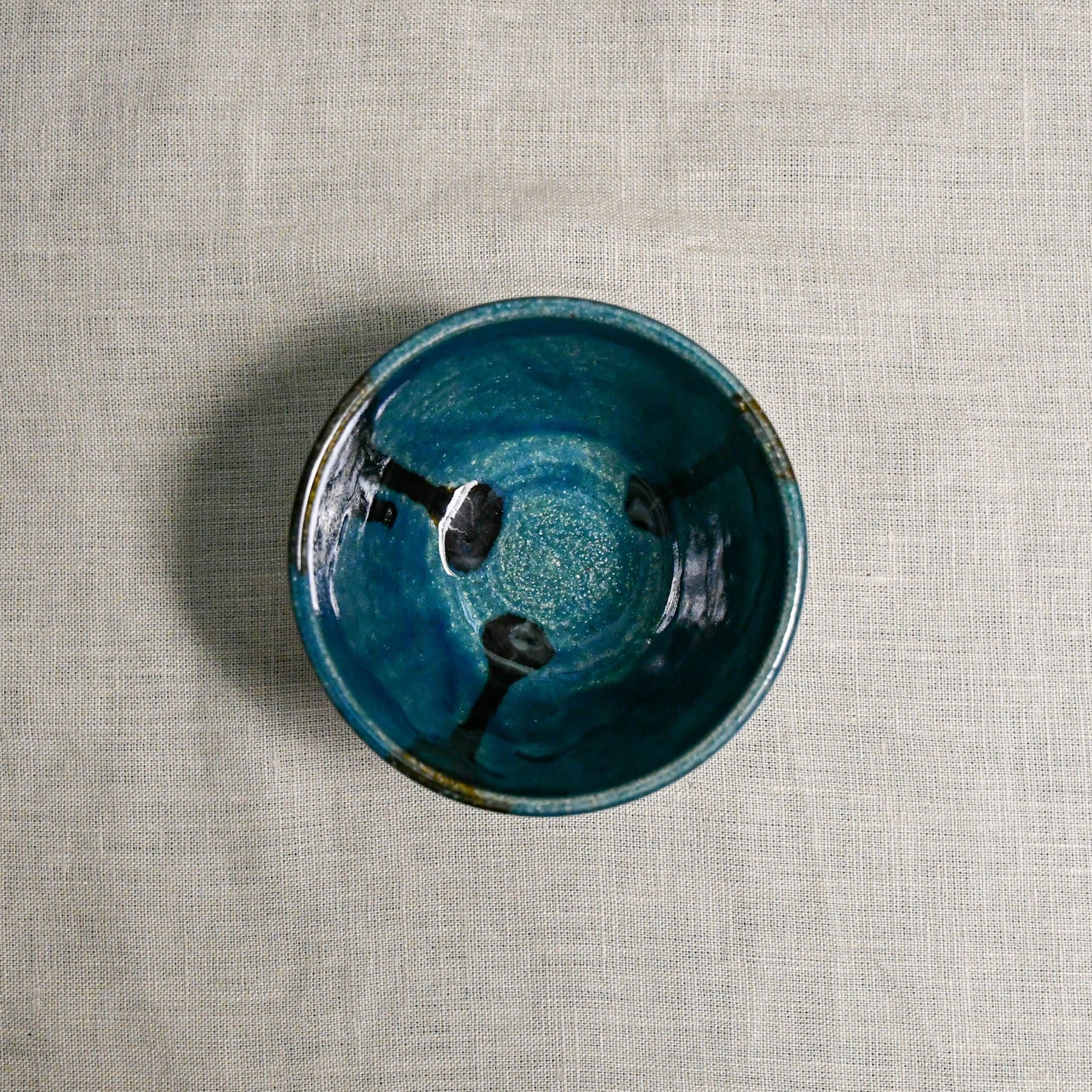 Interior image of a dark teal handmade wheelthrown salsa bowl from the 5th Buffalo collection by Leigh Art.