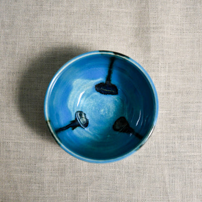 Interior image of a turquoise handmade wheelthrown salsa bowl from the 5th Buffalo collection by Leigh Art.