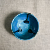 Interior image of a turquoise handmade wheelthrown salsa bowl from the 5th Buffalo collection by Leigh Art.