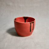 Coral handmade wheelthrown salsa bowl with black drips from the 5th Buffalo collection by Leigh Art.