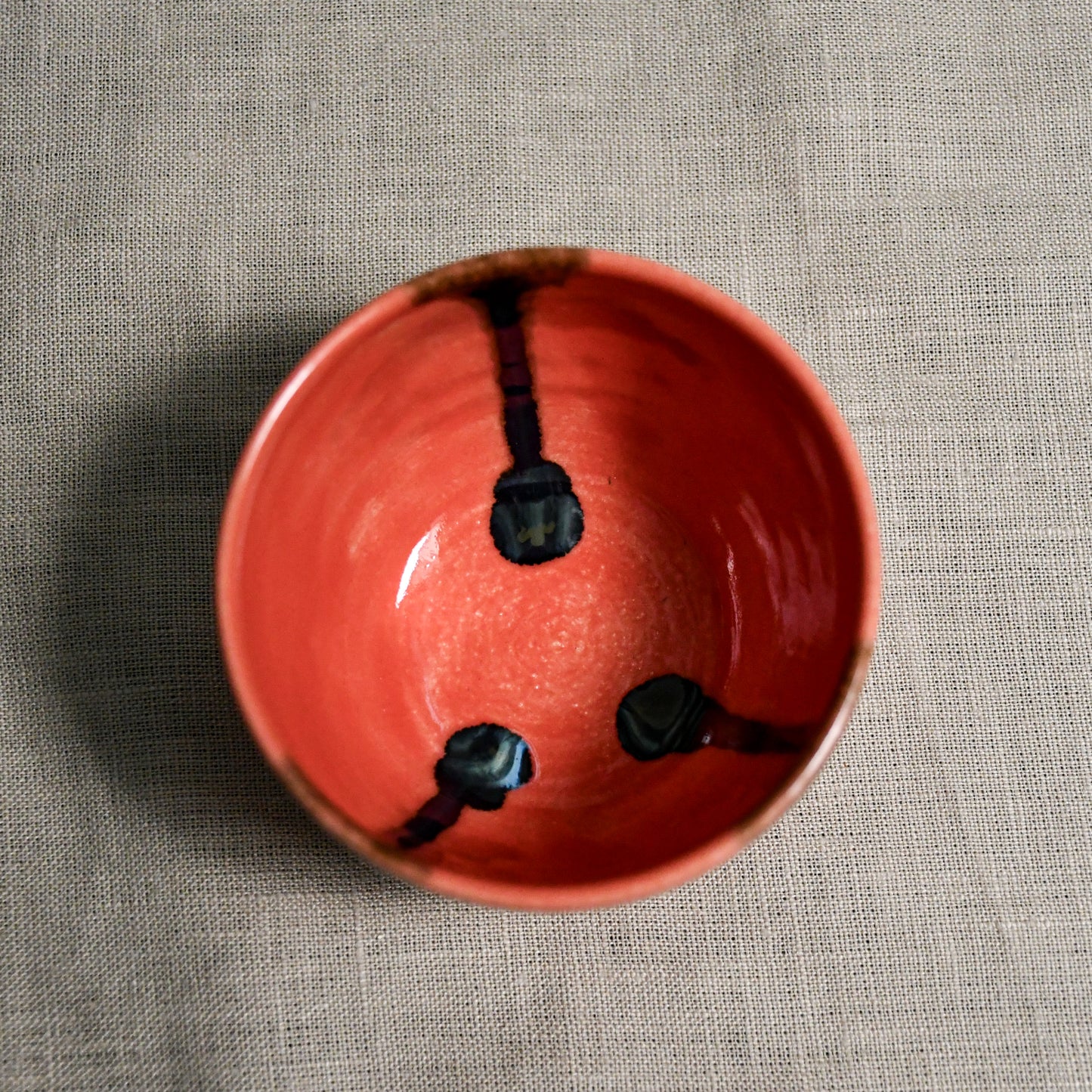 Interior image of a coral handmade wheelthrown salsa bowl from the 5th Buffalo collection by Leigh Art.