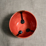Interior image of a coral handmade wheelthrown salsa bowl from the 5th Buffalo collection by Leigh Art.