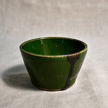 Green handmade wheelthrown salsa bowl with black drips from the 5th Buffalo collection by Leigh Art.