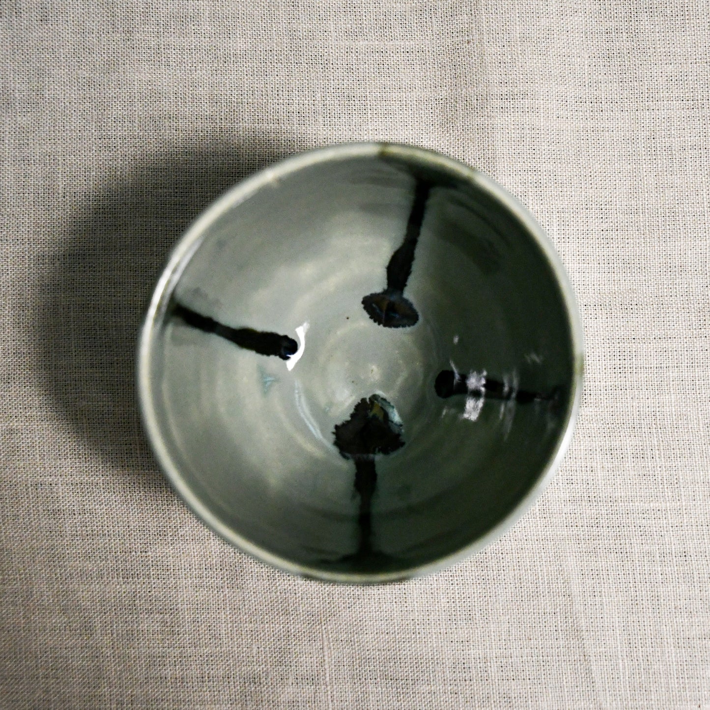 Interior image of a grey handmade wheelthrown salsa bowl from the 5th Buffalo collection by Leigh Art.