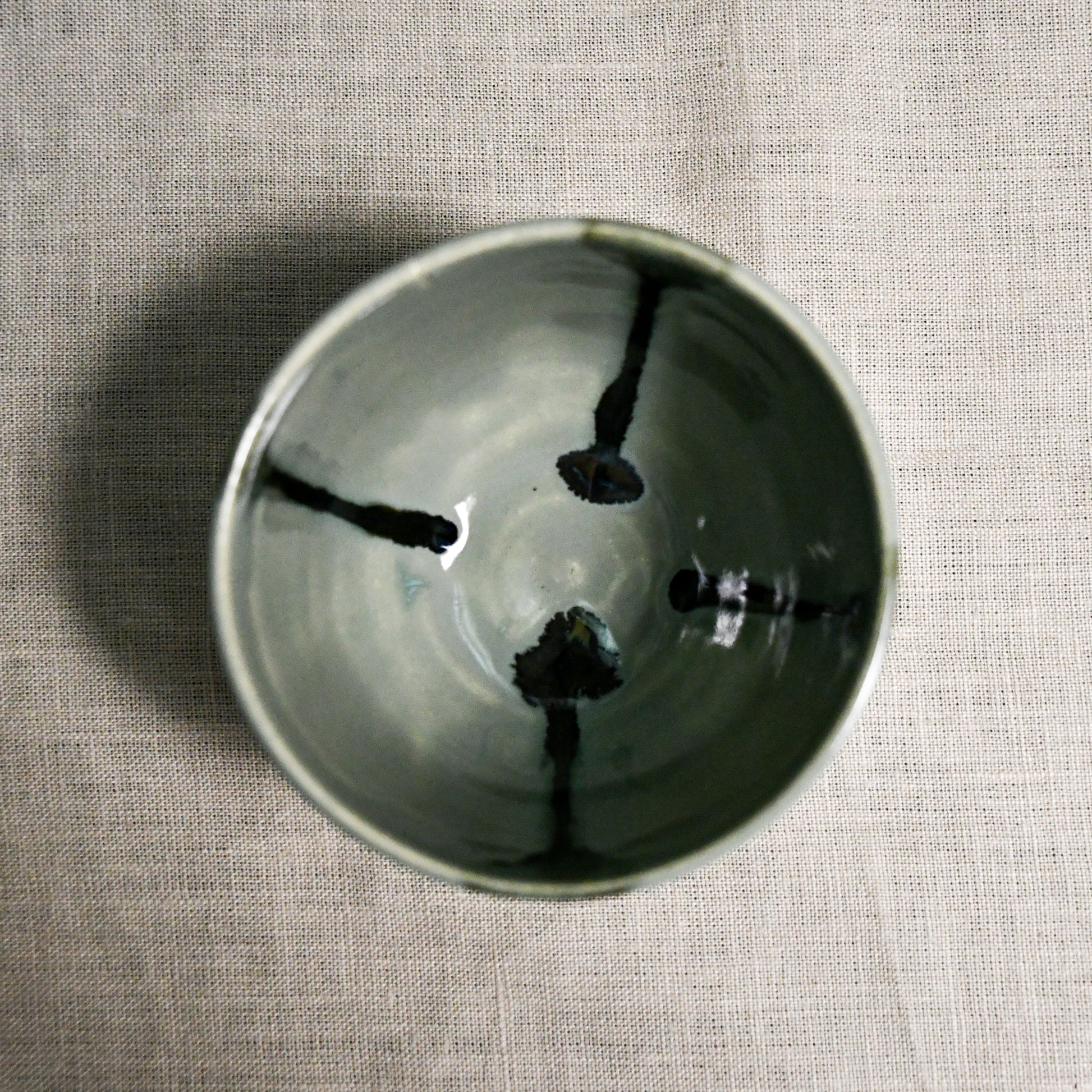 Interior image of a grey handmade wheelthrown salsa bowl from the 5th Buffalo collection by Leigh Art.