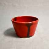 Red handmade wheelthrown salsa bowl with black drips from the 5th Buffalo collection by Leigh Art.