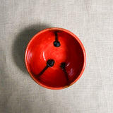 Interior image of a red handmade wheelthrown salsa bowl from the 5th Buffalo collection by Leigh Art.
