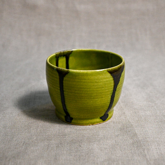 Lime green handmade wheelthrown salsa bowl with black drips from the 5th Buffalo collection by Leigh Art.