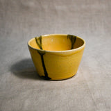 Yellow handmade wheelthrown salsa bowl with black drips from the 5th Buffalo collection by Leigh Art.
