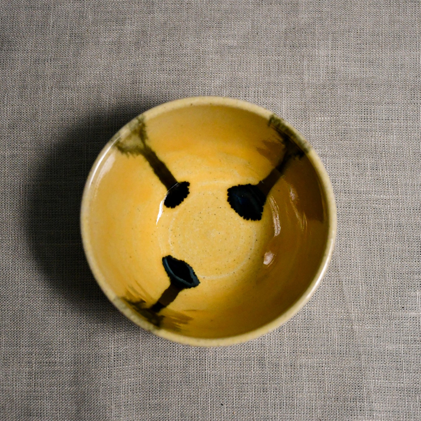 Interior image of a yellow handmade wheelthrown salsa bowl from the 5th Buffalo collection by Leigh Art.