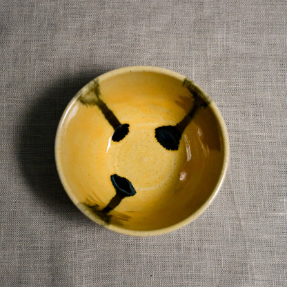 Interior image of a yellow handmade wheelthrown salsa bowl from the 5th Buffalo collection by Leigh Art.