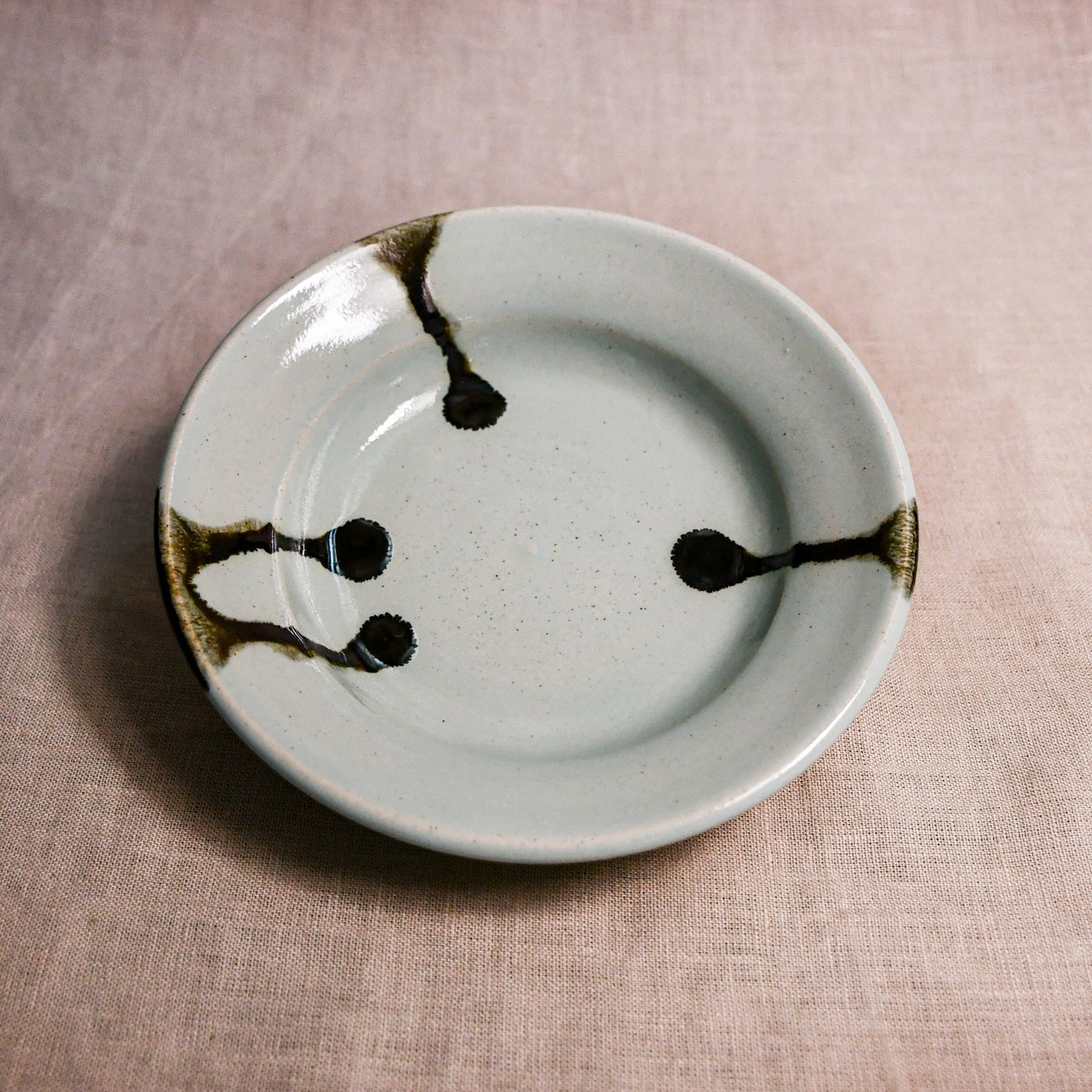 Pale blue handmade wheelthrown pottery saucer from the 5th Buffalo collection by Leigh Art
