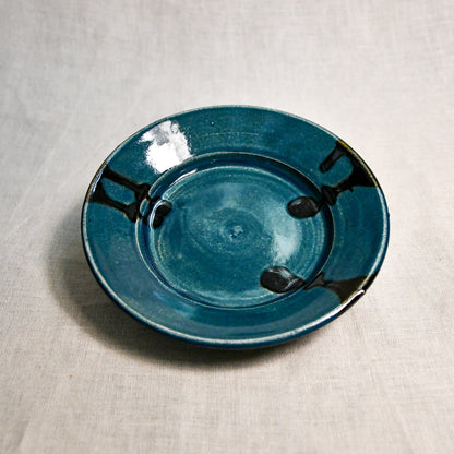 Dark teal handmade wheelthrown pottery saucer from the 5th Buffalo collection by Leigh Art