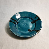 Dark teal handmade wheelthrown pottery saucer from the 5th Buffalo collection by Leigh Art