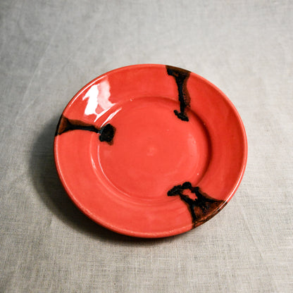 Coral handmade wheelthrown pottery saucer from the 5th Buffalo collection by Leigh Art