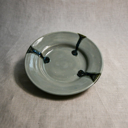 Grey handmade wheelthrown pottery saucer from the 5th Buffalo collection by Leigh Art