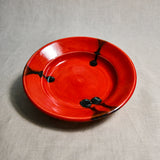 Red handmade wheelthrown pottery saucer from the 5th Buffalo collection by Leigh Art