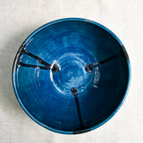Interior image of a dark teal handmade wheelthrown serving bowl from the 5th Buffalo collection by Leigh Art.
