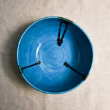 Interior image of a turquoise handmade wheelthrown serving bowl from the 5th Buffalo collection by Leigh Art.