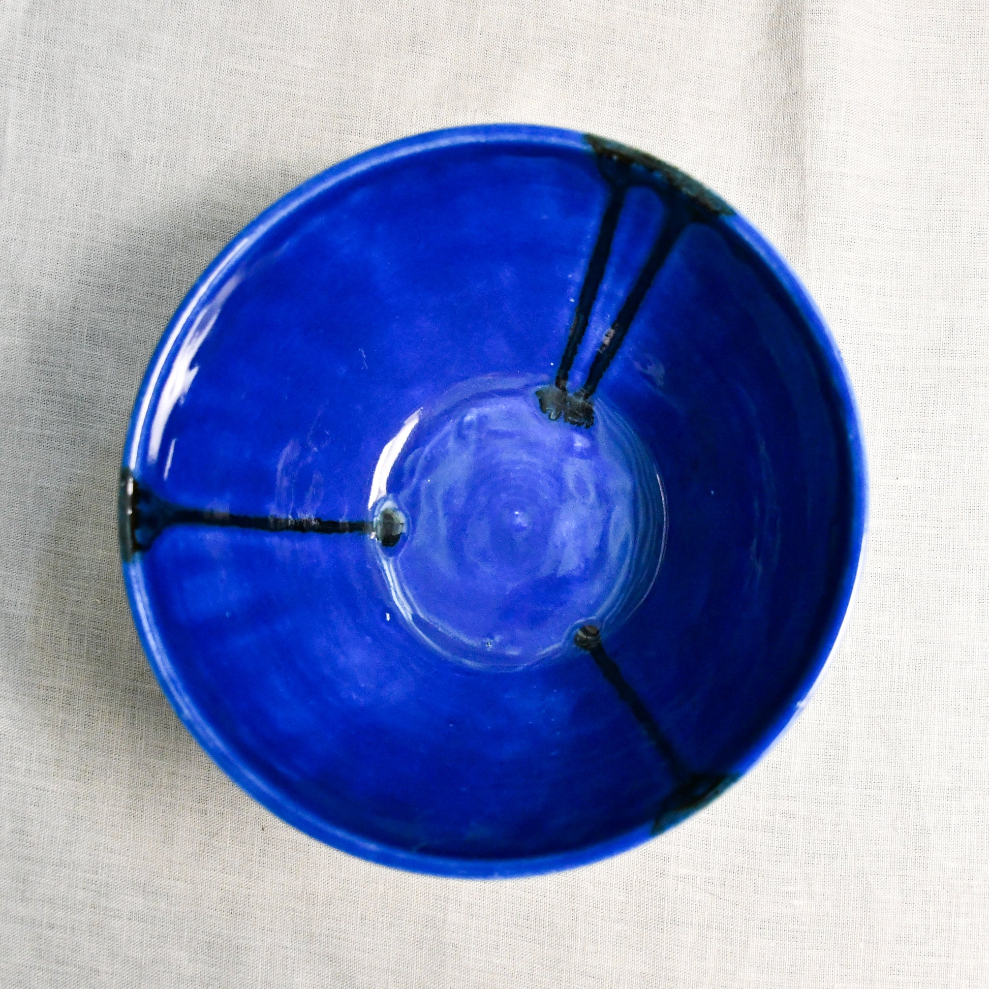 Interior image of a blue handmade wheelthrown serving bowl from the 5th Buffalo collection by Leigh Art.