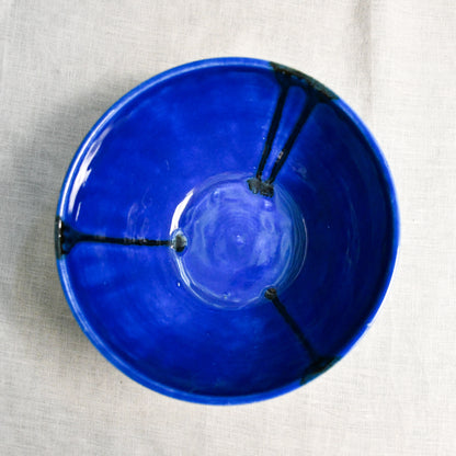 Interior image of a blue handmade wheelthrown serving bowl from the 5th Buffalo collection by Leigh Art.