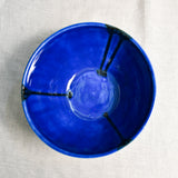 Interior image of a blue handmade wheelthrown serving bowl from the 5th Buffalo collection by Leigh Art.