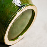 Bottom view of turquoise handmade wheelthrown serving bowl with black drips from the 5th Buffalo collection from Leigh Art. 