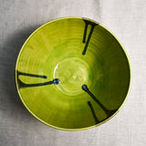 Interior image of a lime green handmade wheelthrown serving bowl from the 5th Buffalo collection by Leigh Art.