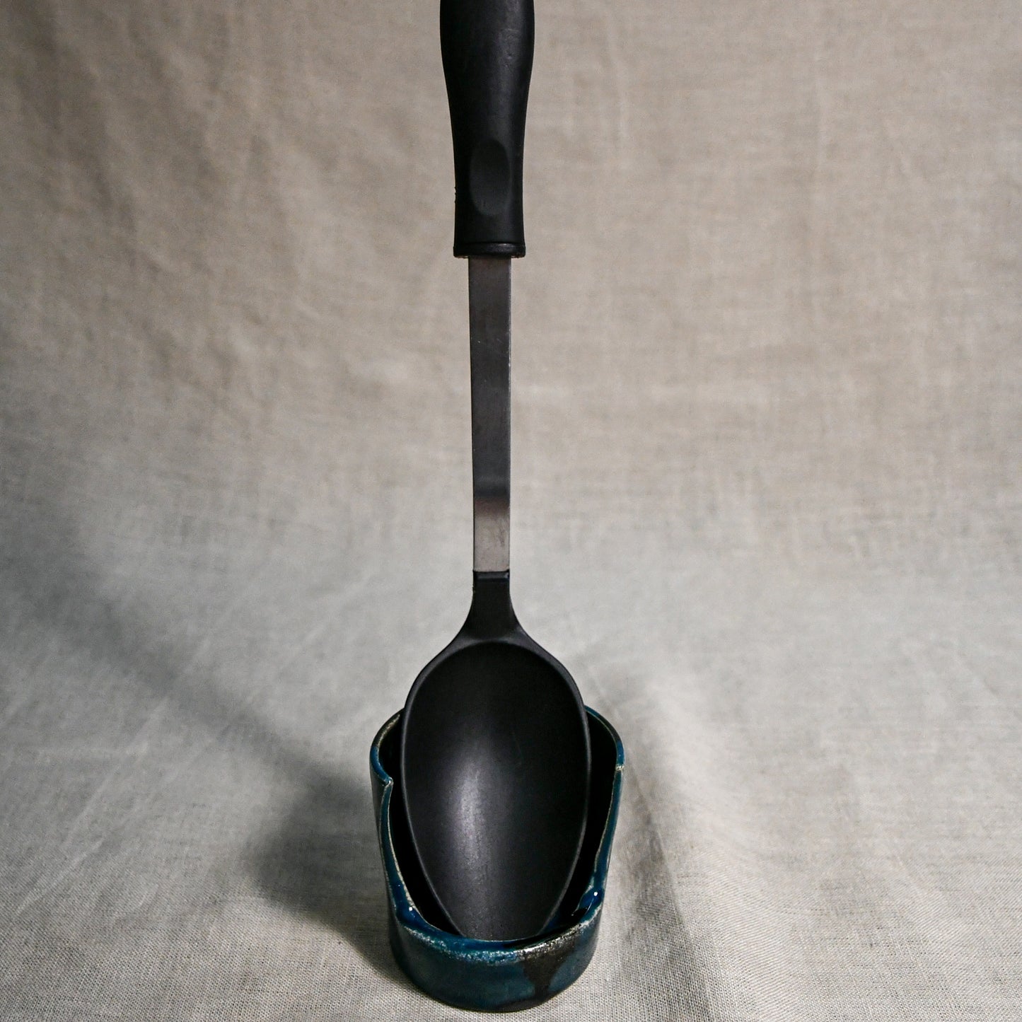 Vertical dark teal handmade spoon rest with serving spoon from the 5th Buffalo collection by Leigh Art