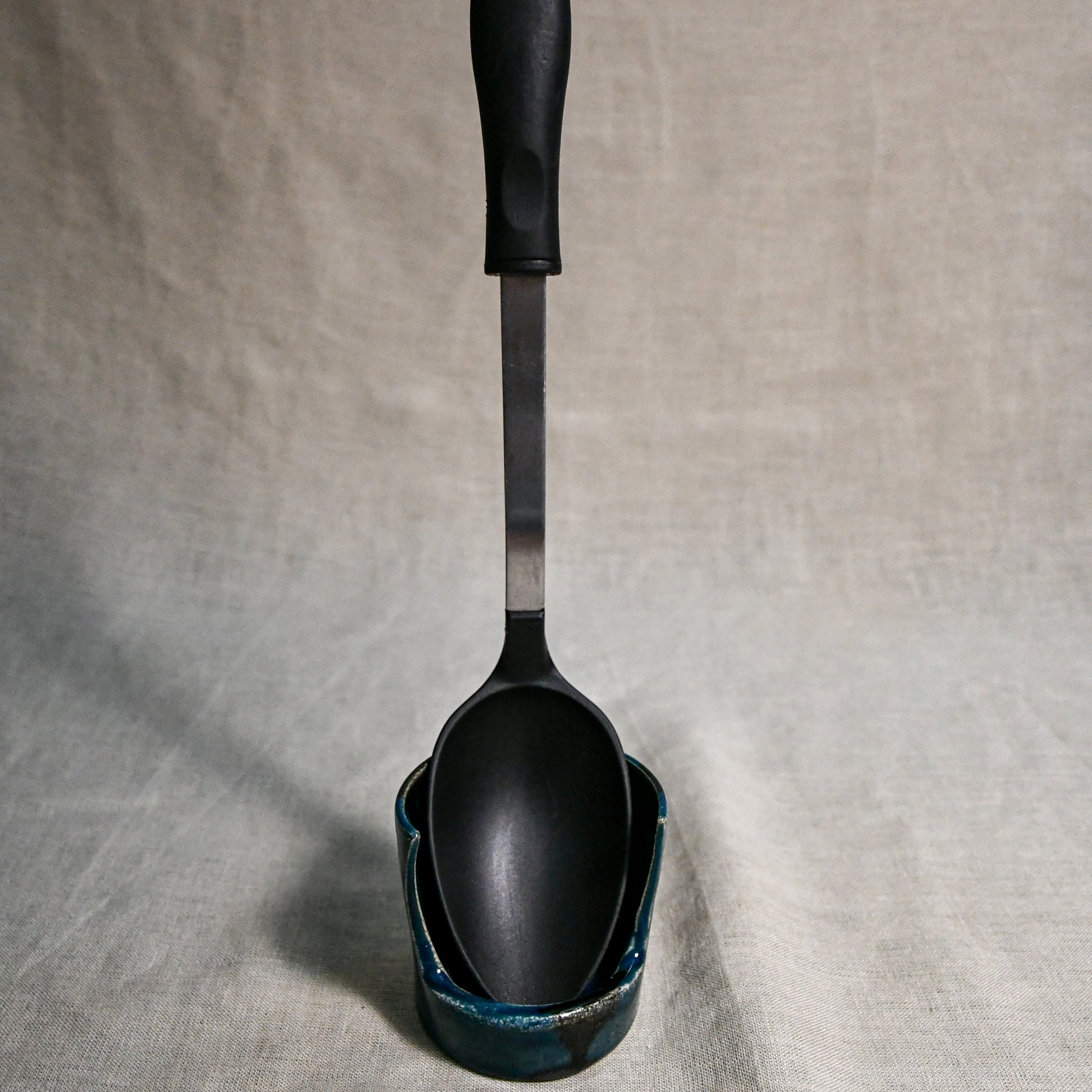 Vertical dark teal handmade spoon rest with serving spoon from the 5th Buffalo collection by Leigh Art