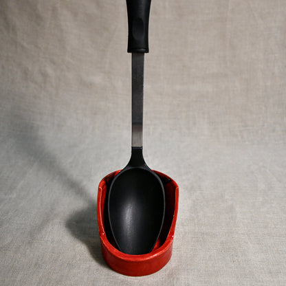 Vertical red handmade spoon rest with serving spoon from the 5th Buffalo collection by Leigh Art