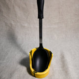 Vertical yellow handmade spoon rest with serving spoon from the 5th Buffalo collection by Leigh Art
