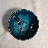 Interior image of a dark teal handmade wheelthrown chili bowl from the 5th Buffalo collection by Leigh Art.