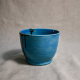 Interior image of a turquoise handmade wheelthrown chili bowl from the 5th Buffalo collection by Leigh Art.