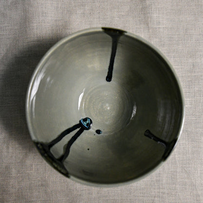 Interior image of a grey handmade wheelthrown chili bowl from the 5th Buffalo collection by Leigh Art.