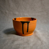 Orange handmade wheelthrown chili bowl from the 5th Buffalo collection by Leigh Art.