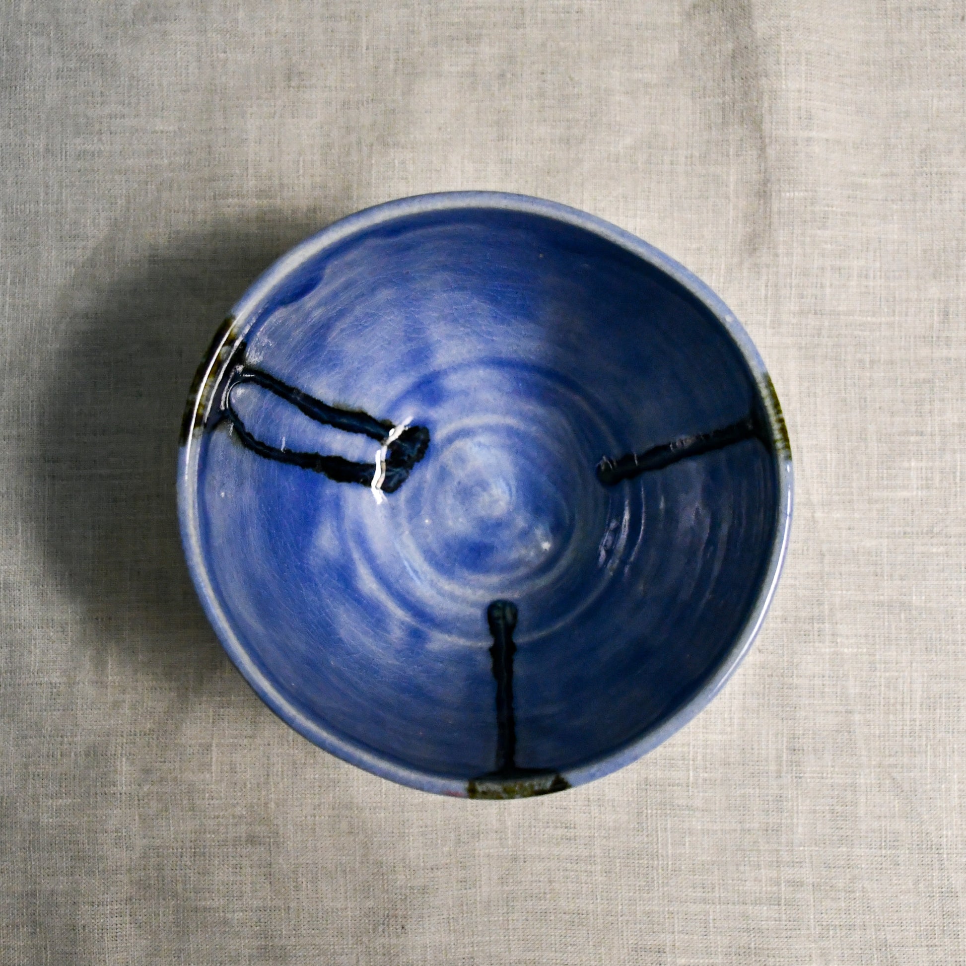 Interior image of a purple handmade wheelthrown chili bowl from the 5th Buffalo collection by Leigh Art.