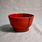 Red handmade wheelthrown chili bowl from the 5th Buffalo collection by Leigh Art.