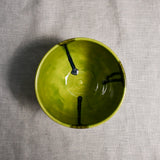 Interior image of a lime green handmade wheelthrown chili bowl from the 5th Buffalo collection by Leigh Art.