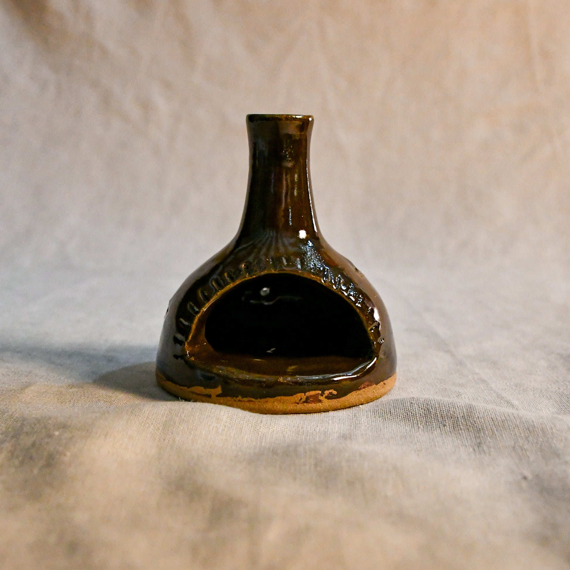 Handmade countertop chiminea, wheel thrown, hand-carved, fit for a tea light and glazed in Coffee Bean glaze. 